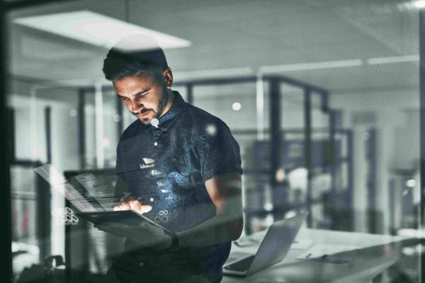 Man viewing computer screen for observability for good